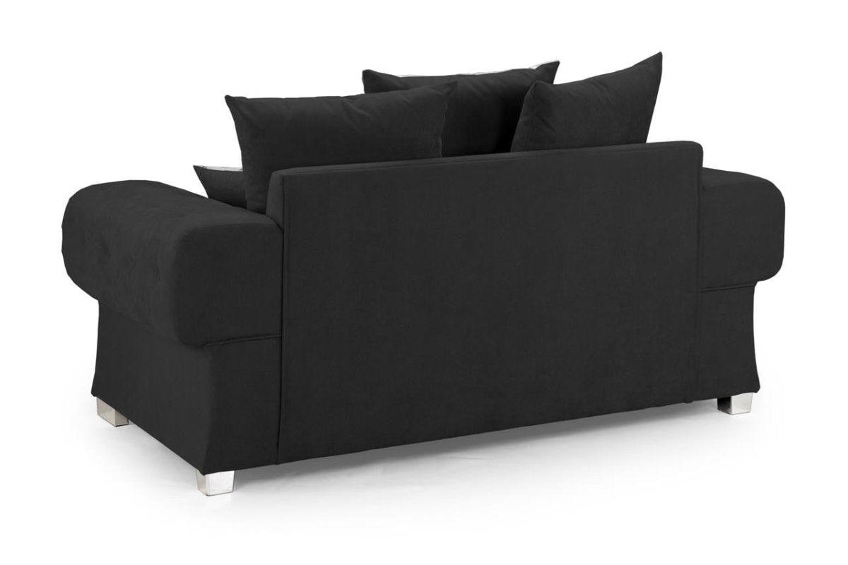 Black scatter back 2 seater sofa with plush cushions and chrome feet on white background