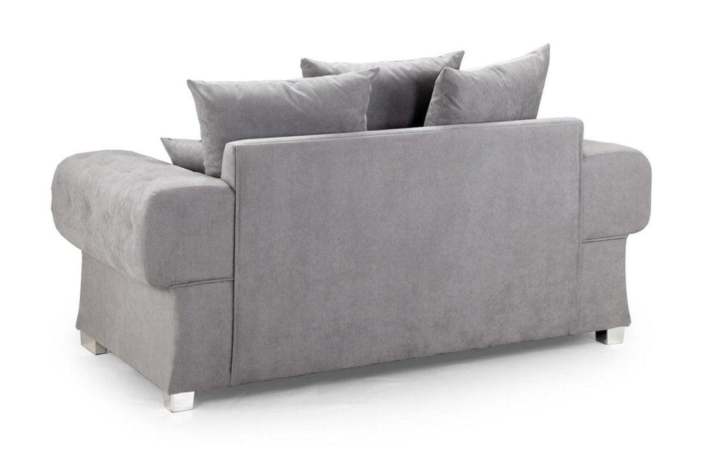 Modern grey two-seater sofa with plush cushions and metal feet, viewed from the back
