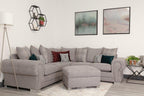 Modern living room with large grey scatter back corner sofa and matching ottoman