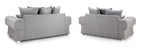 Set of two grey scatter back sofas with plush cushions on white background