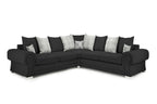 Black corner sofa with plaid and stag print scatter cushions, modern living room furniture