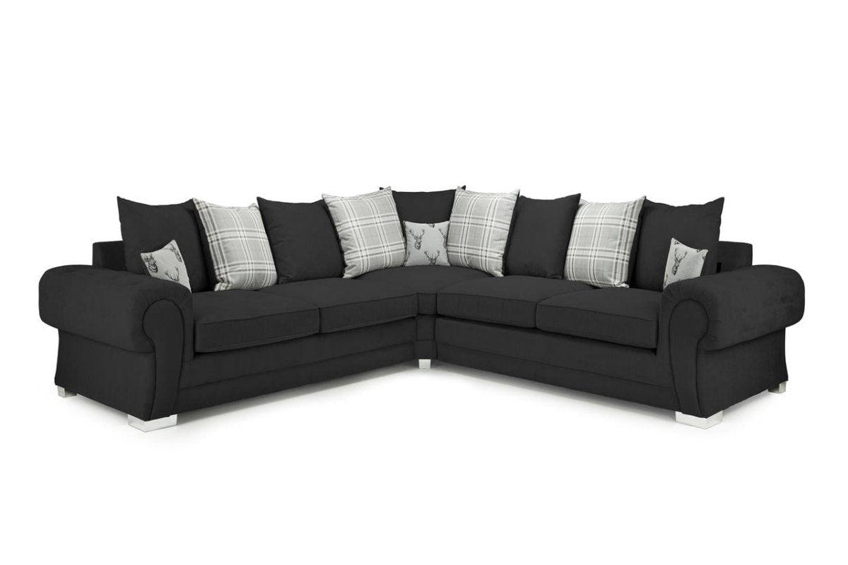 Black corner sofa with plaid and stag print scatter cushions, modern living room furniture