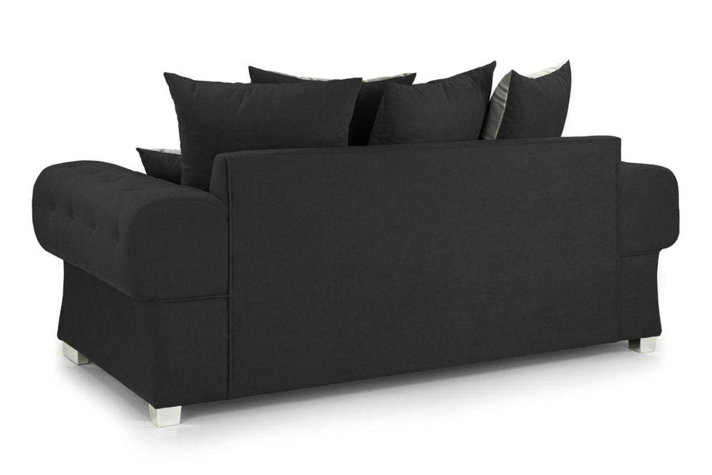 Black three-seater sofa with scatterback design and chrome legs on a white background