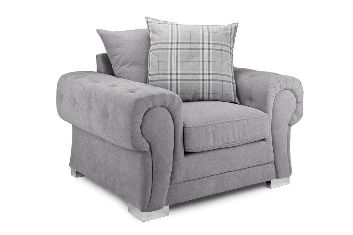 Grey velvet scatterback armchair with rolled arms and plaid cushion on white background