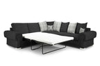 Black corner sofa bed with plaid and deer print scatter cushions, extended into a bed
