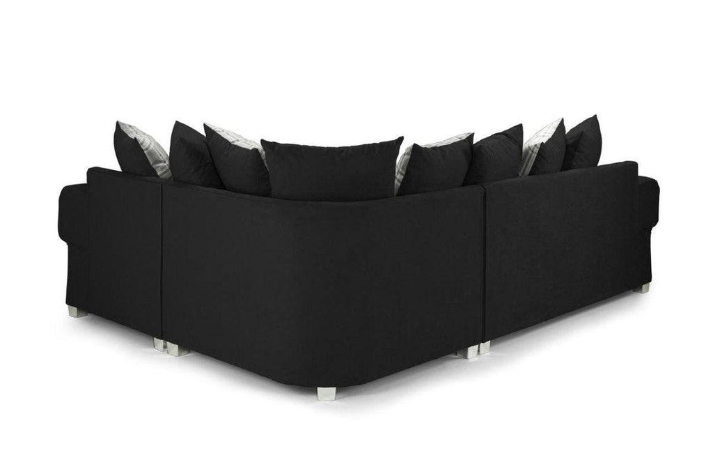 Modern black left hand corner sofa with scatterback cushions and silver legs