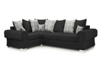 Black right hand corner sofa with rolled arms, scatterback plaid and stag cushions