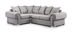 Grey corner sofa with scatterback cushions and plaid accents, modern tufted arms