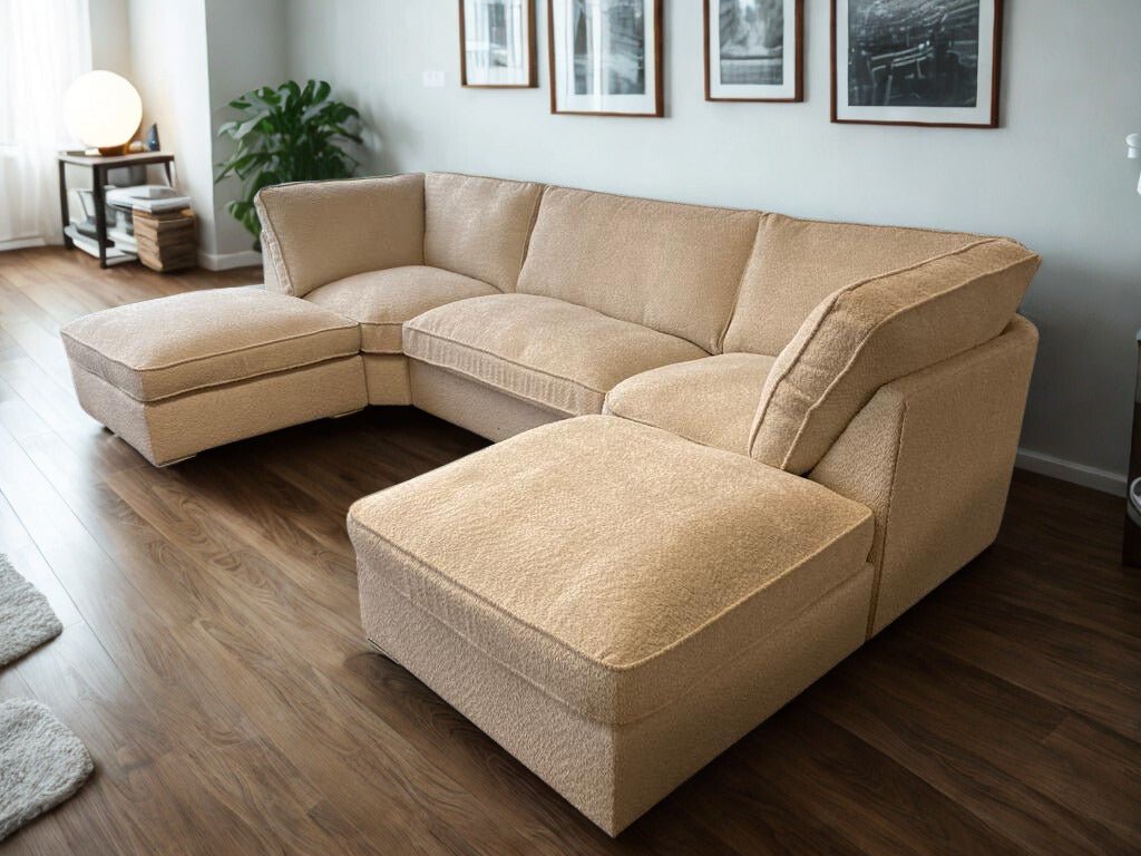 Cream boucle U-shaped large sofa in a modern living room with wood flooring