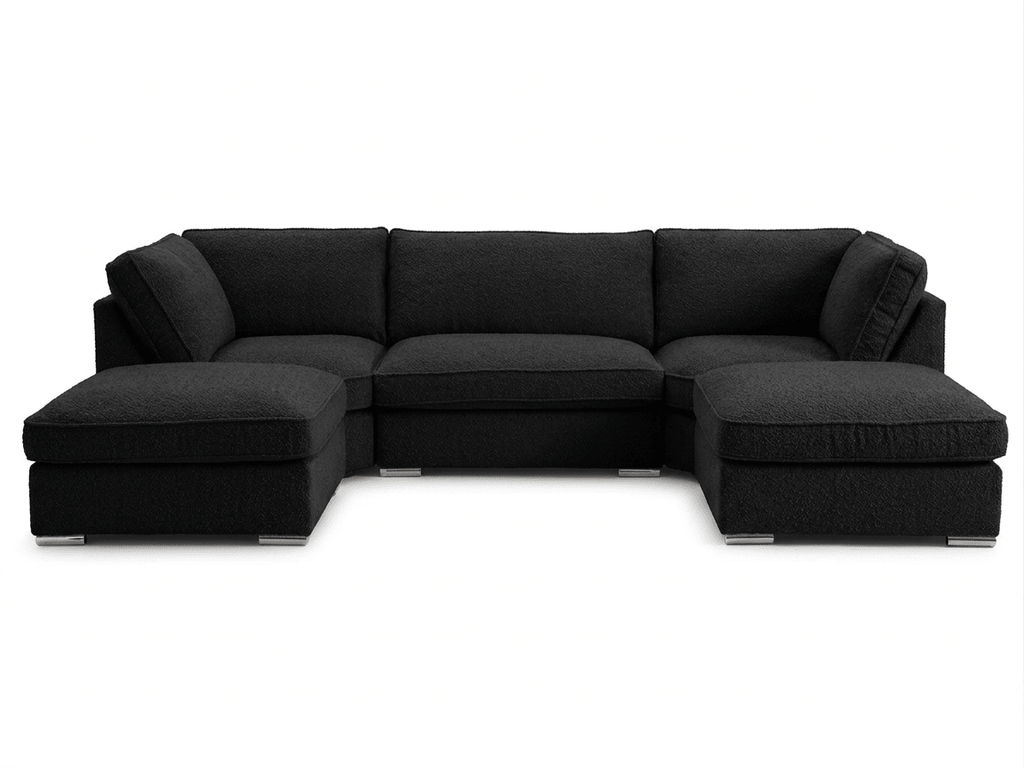 Large U-shaped boucle sofa in cream with plush cushions on a white background