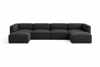 Modern dark grey U-shaped modular sofa with low back and plush seating, isolated on white