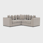 Cream double corner sofa with plush cushions on a white background