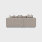 Cream double corner sofa with plush cushions, modern minimalist design on white background