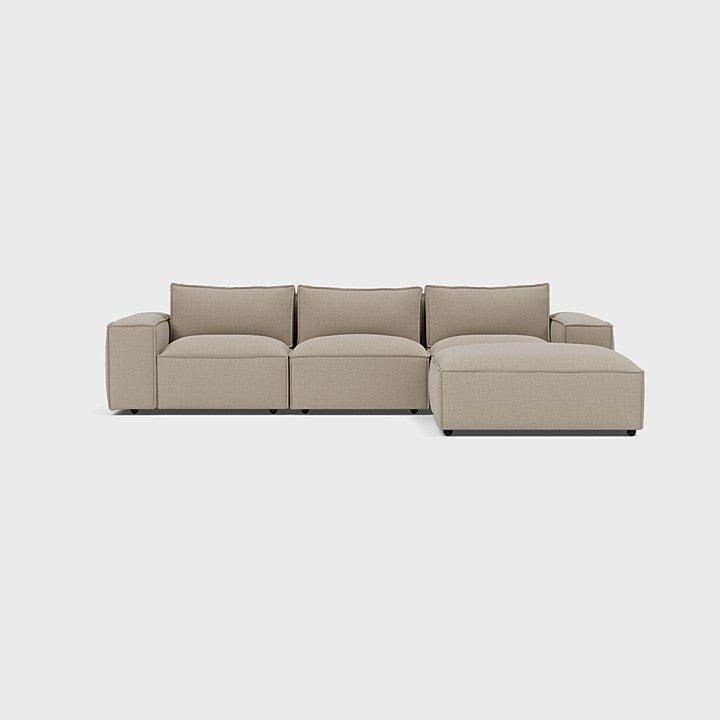 Modern cream modular corner sofa with right chaise, three seats, minimalist setting