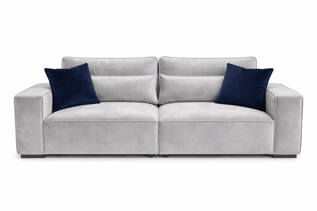 Modern cream 4-seater sofa with navy cushions, plush upholstery, and wide armrests
