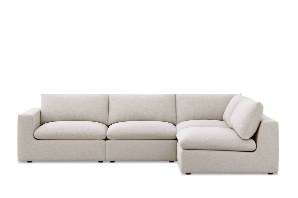 Cream feather-filled corner sofa with plush cushions and modern block arms