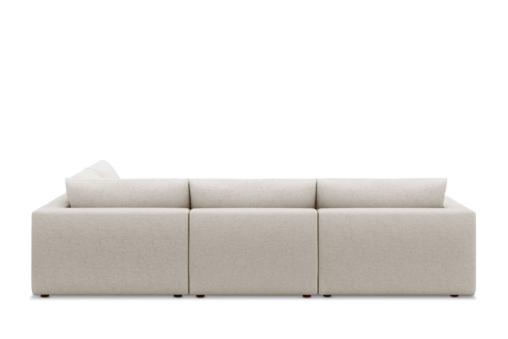 Modern cream open corner sectional sofa with feather-filled cushions, rear view