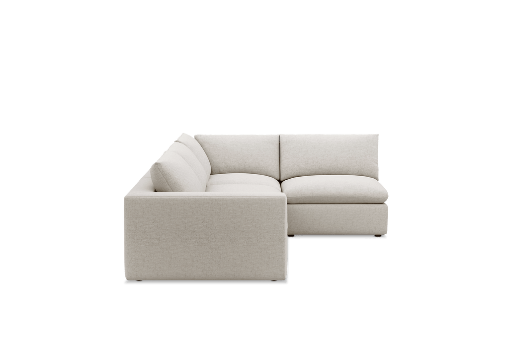 Cream feather-filled open corner sofa with plush cushions, modern L-shaped sectional