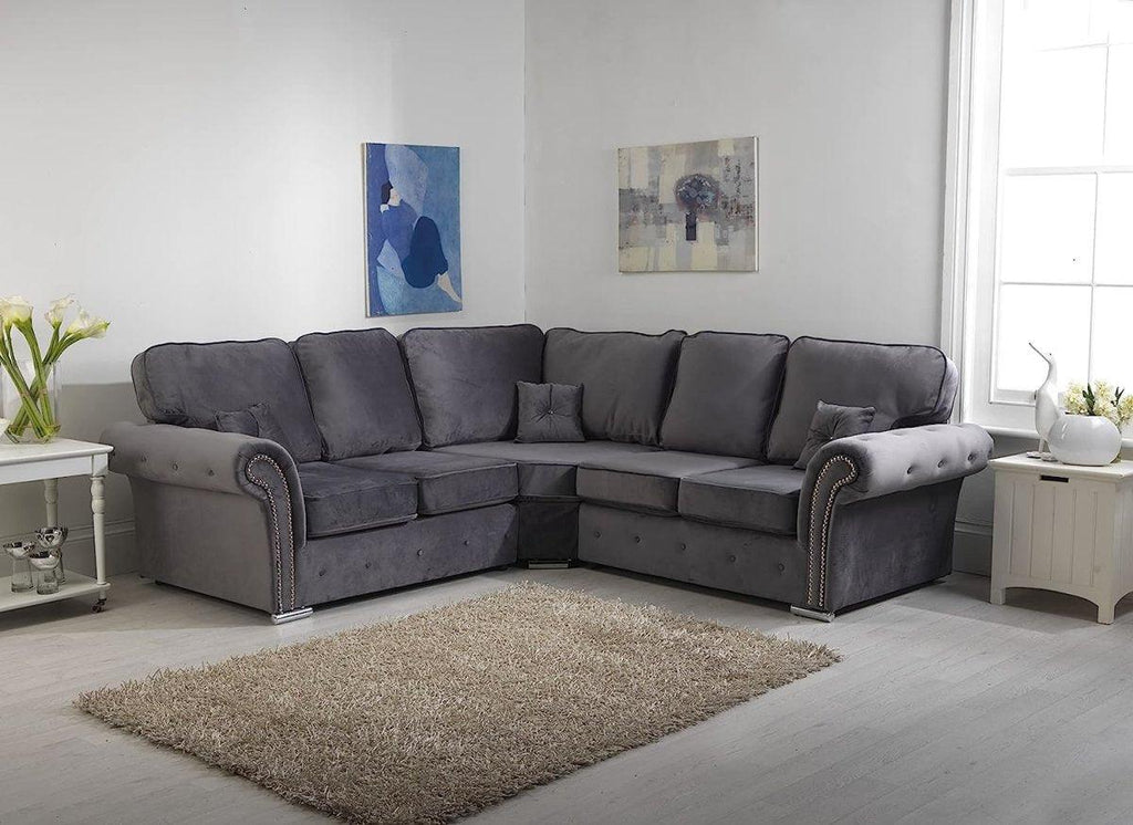 Grey corner sofa with full back cushions in a modern living room setting