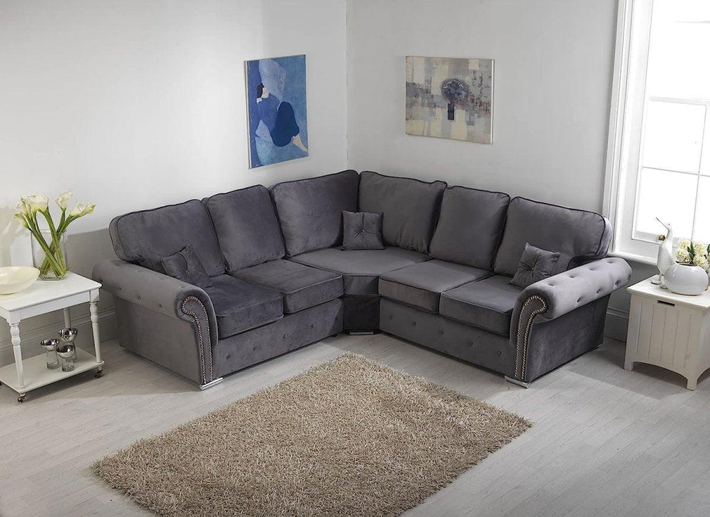 Grey corner sofa with full-back cushions in a modern living room, next to light wood decor