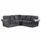 Dark grey L-shaped corner sofa with plush full-back cushions and studded armrests