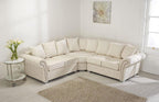 Cream corner sofa with scatter back cushions in a bright living room with light decor