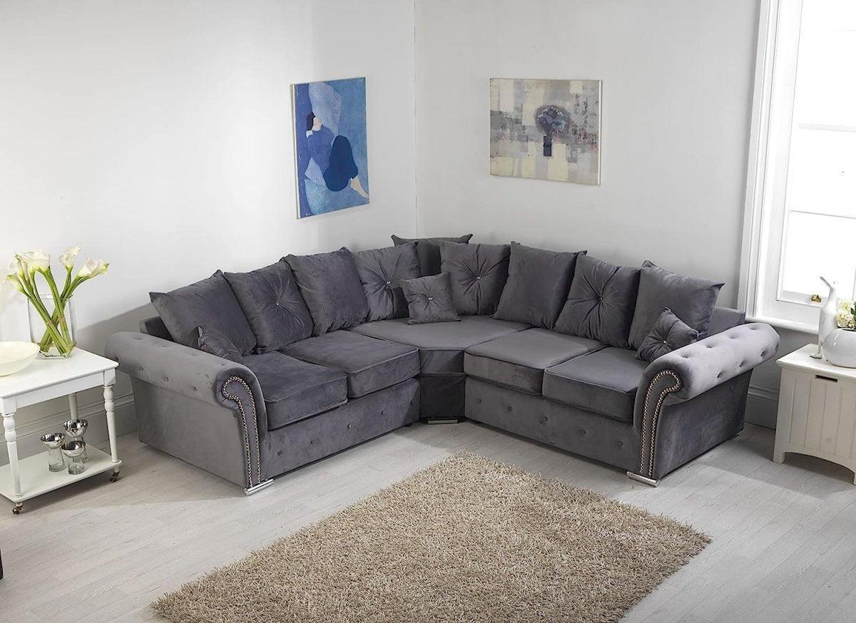 Grey corner sofa with scatterback cushions in a bright modern living room