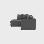 Modern grey right-hand corner sofa with plush cushions on a plain background