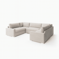 Cream U-shape sectional sofa with fiber-topped cushions and modern design on white background.