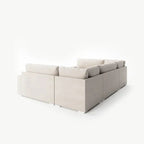 Cream U-shaped modular sofa with plush cushions on white background