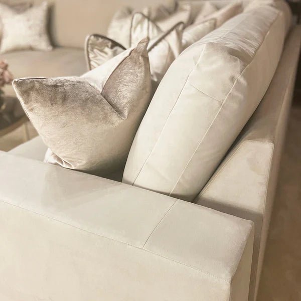 Cream U-shape sofa with plush fiber cushions and soft accent pillows in a living room