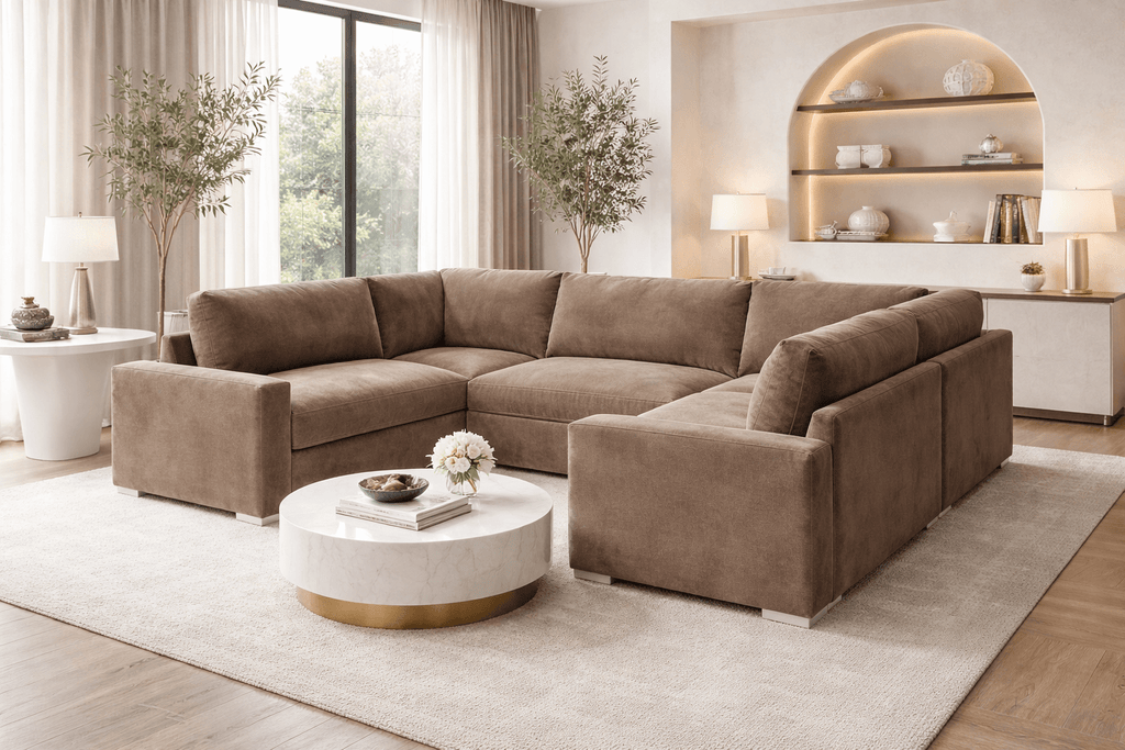 U-shape cream fabric sofa in modern living room with large windows and marble coffee table