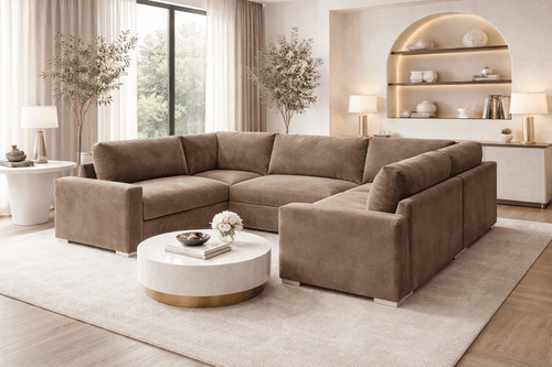 U-shape cream fabric sofa in modern living room with large windows and marble coffee table