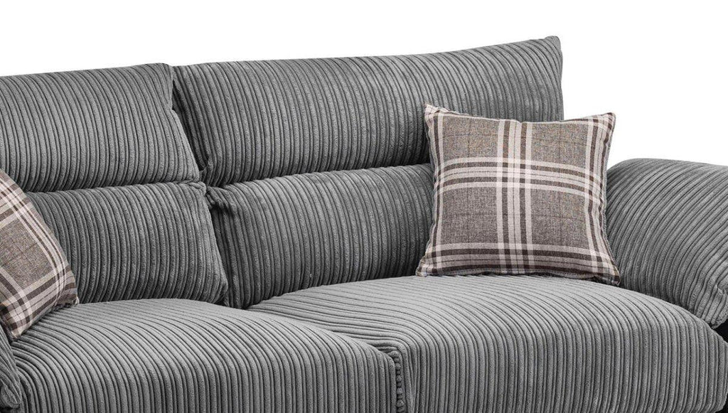 Grey corduroy corner sofa with textured cushions and plaid accent pillows