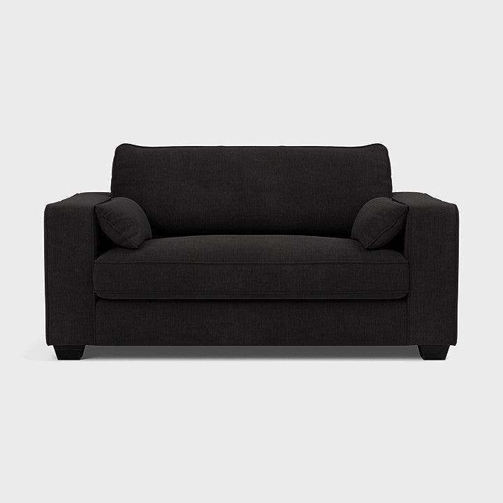 Modern black fabric loveseat sofa with square arms and two cushions on a light background
