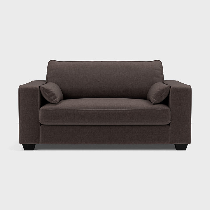 Modern espresso brown love seat sofa with square arms and two matching cushions on white background