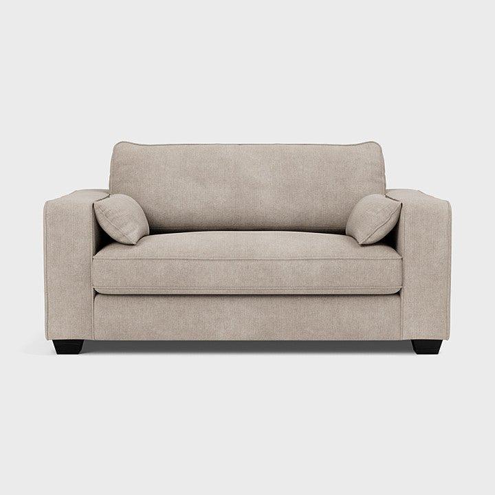 Beige love seat sofa with square arms and two side cushions on a white background
