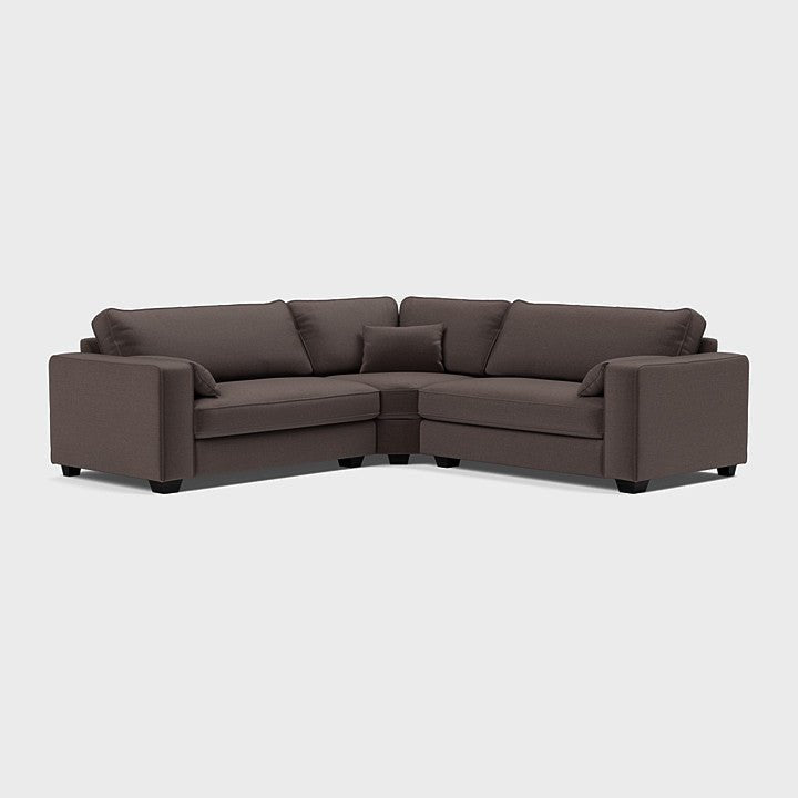 Large espresso brown corner sofa with plush cushions on a plain white background