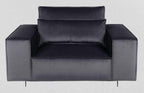 Modern grey armchair with wide arms and plush cushions on a light background