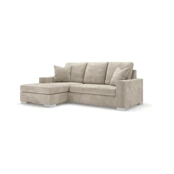 Modern grey corner sofa with chaise lounge and plush cushions on white background