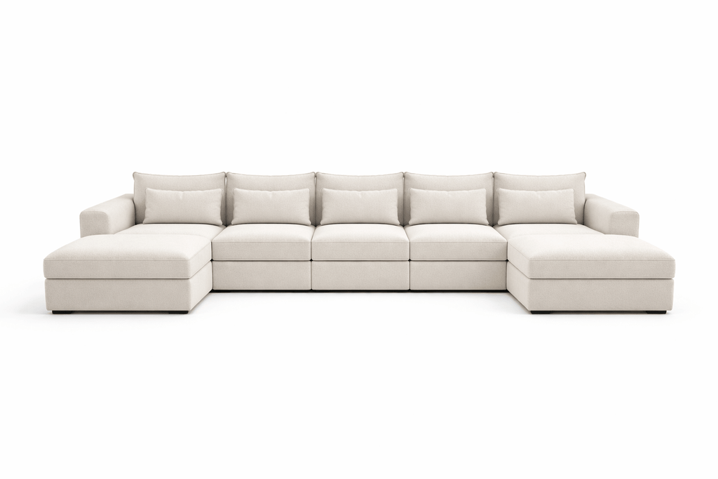 Large U-shaped cream boucle sofa with wide cushions and low armrests on both sides
