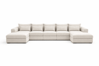 Large U-shaped cream boucle sofa with wide cushions and low armrests on both sides