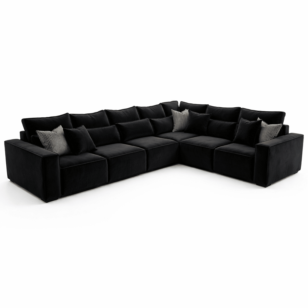 Large black modular corner sofa with plush cushions and accent pillows, modern living room seating.