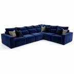 Modern blue modular corner sofa with plush cushions and decorative accent pillows