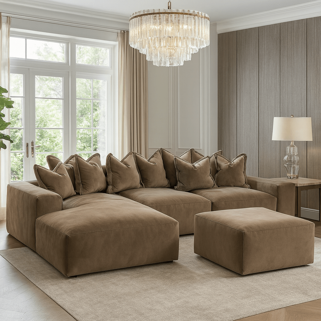 Large left-hand facing mink velvet pillow back sofa with matching ottoman in modern living room