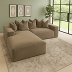 Large velour mink velvet left-hand facing sofa with pillow back in modern living room