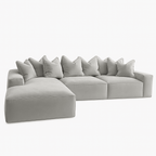 Large silver velvet pillow back sectional sofa with left-hand chaise on white background