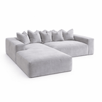 Large silver velvet sectional sofa with pillow back and left-hand chaise on white background