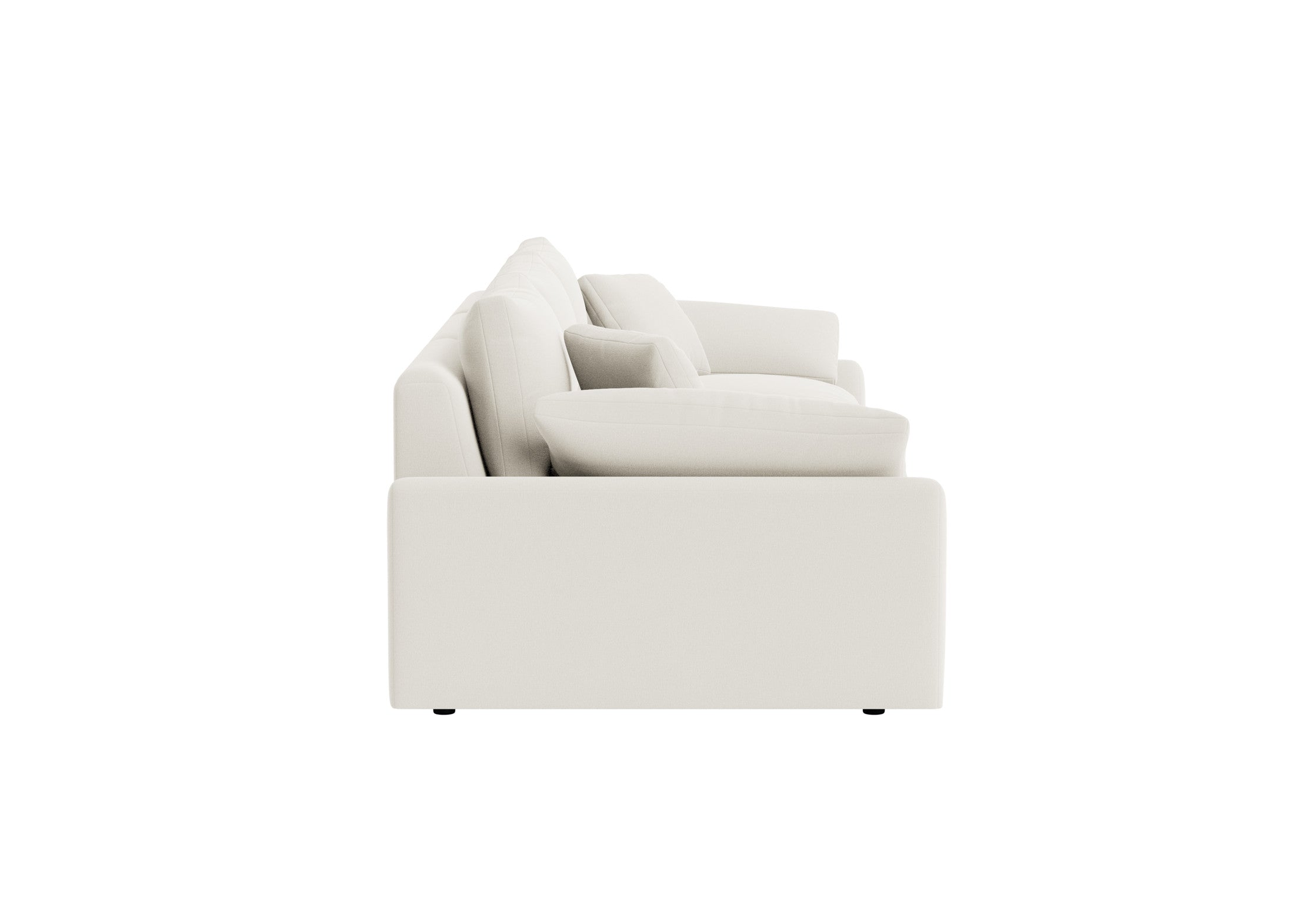 Side view of a cream modular sofa with plush back and seat cushions on a white background