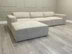Ivory modular cinema sofa with removable footstool on grey wood floor in modern room